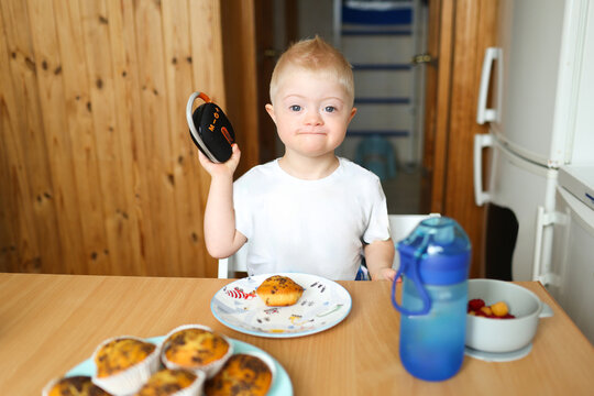 A child  with Down syndrome at home
