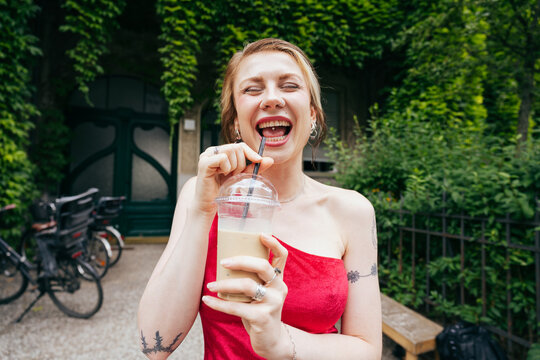 Laughing Woman With Iced Drink