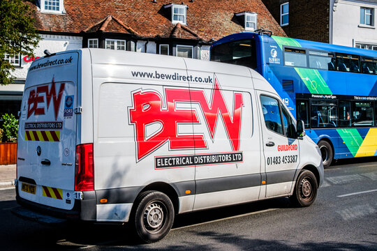 Close Up Of A BEW Electrical Distributors Mercedes Van Driving On A Town Centre High Street