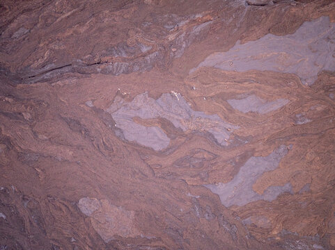 Aerial view of volcanic lava flows and hardened rock textures on the island of La Palma, Canary Islands, Spain.
