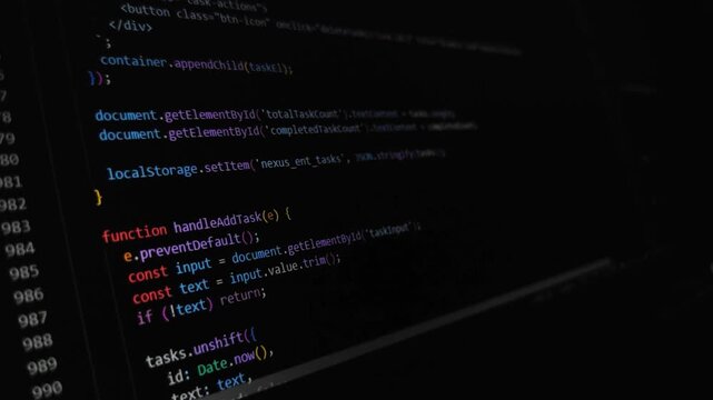 Software development source code scrolling on dark screen