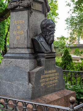 Saint Petersburg, Russia - August 1, 2026: bust of Russian writer Fyodor Dostoevsky on his grave at Necropolis of Masters of Art of Tikhvin Cemetery in Alexander Nevsky Lavra in Saint Petersburg city