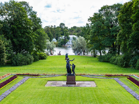 Pushkin, Russia - August 3, 2026: sculpture Venus and Cupid on granite pedestal in front of Big Pond in Catherine Park in Tsarskoye selo town on sunny summer day