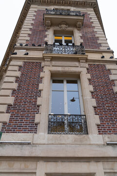 Pigeons Perched on an Ornate Historic Brick Building
