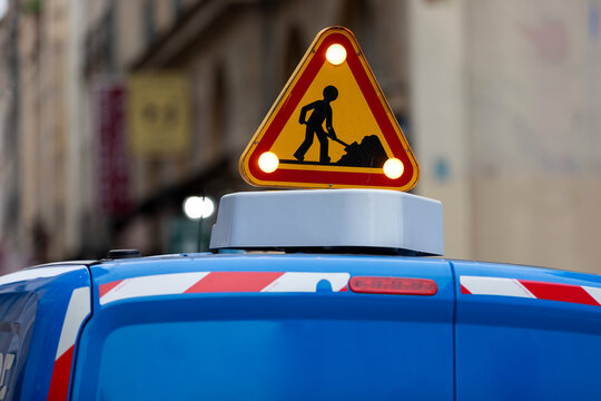 Illuminated Roadworks Warning Sign on a Maintenance Vehicle