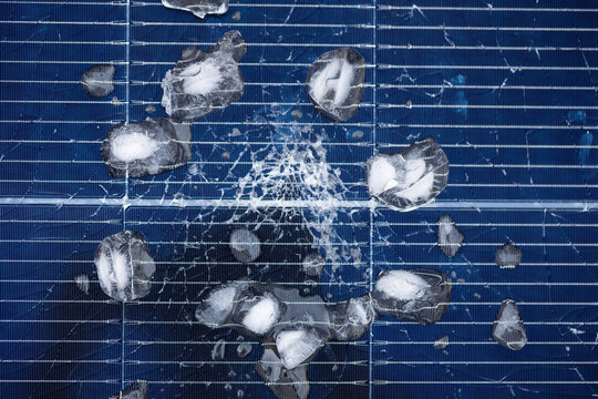 Hail-Damaged Solar Panel with Ice and Shattered Glass