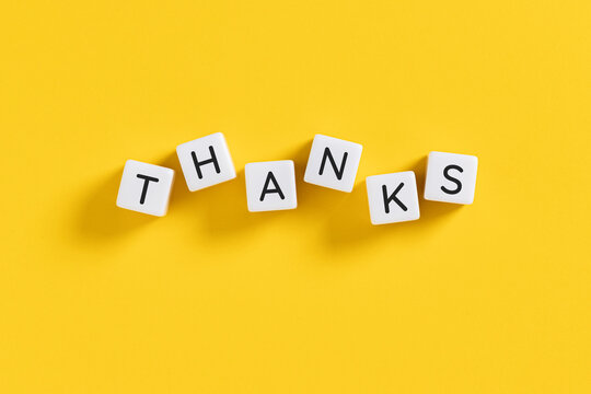 thanks message on white blocks on yellow background