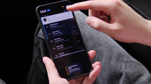User checks a mobile inbox as a promotional message appears, capturing email marketing, personalized offers and the constant competition for attention in digital communication.