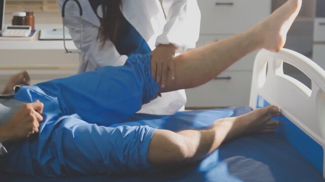 Physical therapist performing ankle examination on patient in clinic