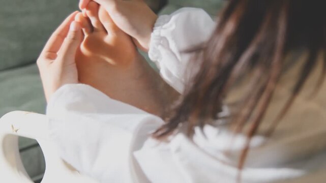 Physical therapist performing ankle examination on patient in clinic
