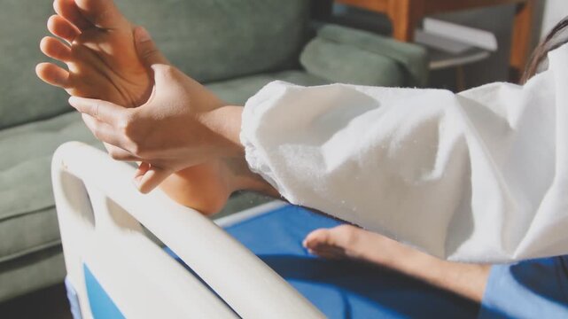 Physical therapist performing ankle examination on patient in clinic
