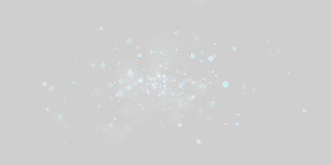 Blue snowflakes drift across a dark background in this serene winter scene. Soft glowing particles of varied sizes create a sense of depth and gentle motion. © longstock