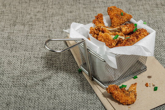 Battered and deep-fried oyster mushrooms (Pleurotus) with dipping sauce and green onion