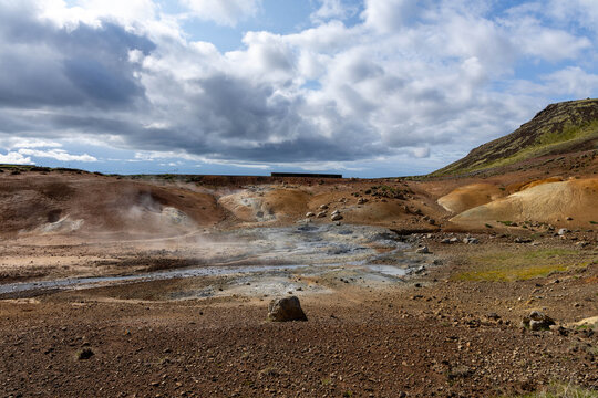 Steaming fumaroles and mineral-colored soil at a geothermal field, Seltun/Krysuvik, Reykjanes, Iceland.