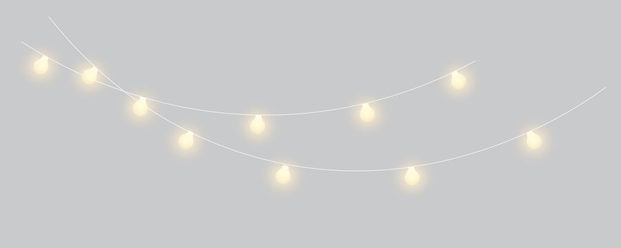 Golden fairy lights hanging garland with copy space for Christmas, New Year, wedding and celebration banners