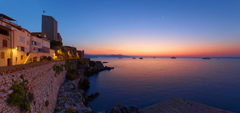 Antibes ramparts panorama at dusk, French Riviera.