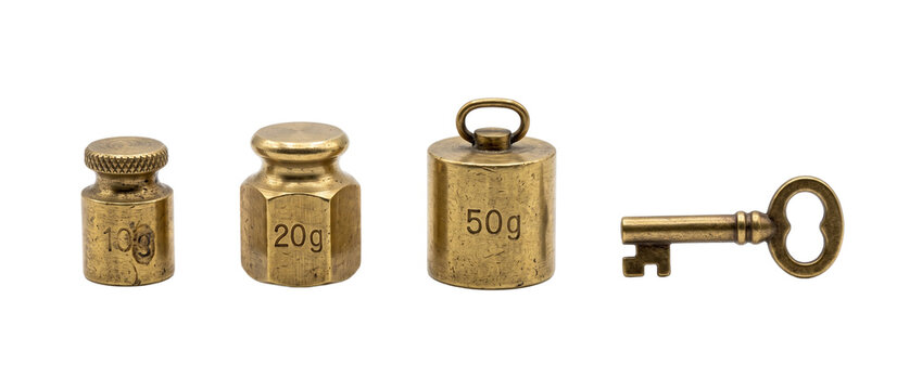 Vintage brass weights and key lined up on black background representing balance growth and security solutions for measurement scale precision isolated antique metal object set concept.