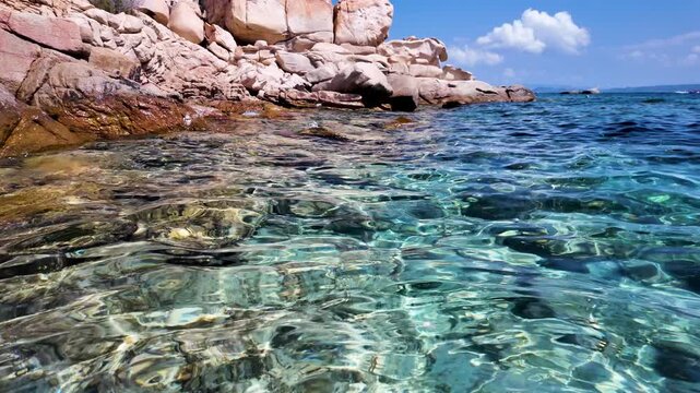 Crystal clear turquoise water off the coast of Spargi Island in the La Maddalena Archipelago, Sardinia, Italy