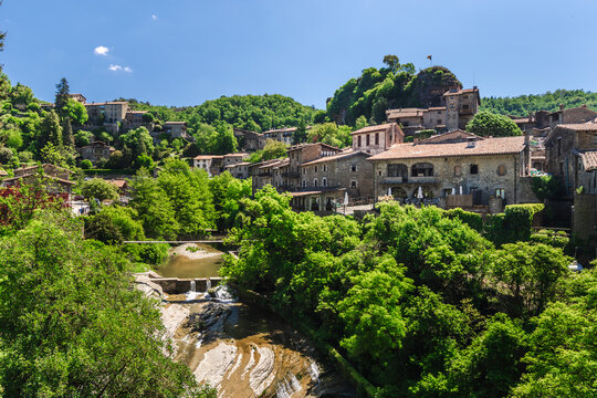 Panoramic view of Rupit medieval village in Catalonia, Spain, with historic stone houses, lush green forest