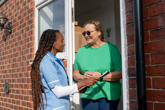 Healthcare worker visits a home to provide support and assistance to an older woman