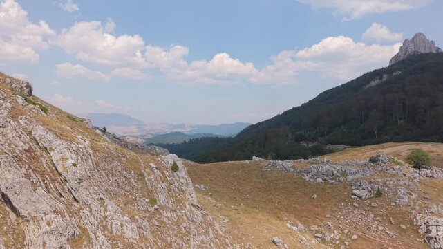 Drone Aerial View Flying Across Rocky Slopes and Mountain Ridge Towards Peak on Visocica