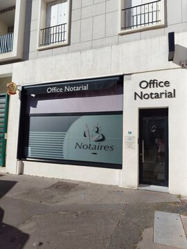 Royan, France - May 31, 2026: Charente-Maritime. Nouvelle-Aquitaine. Office Notarial building exterior with signage displaying Notaires, located on a street in a modern urban setting