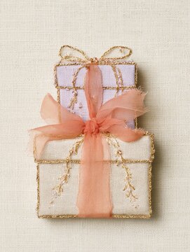 Luxury stacked gift boxes decorated with ribbon and delicate embroidery, elegant birthday present box, festive holiday packaging, luxury christmas gift wrap concept layout top view macro photo