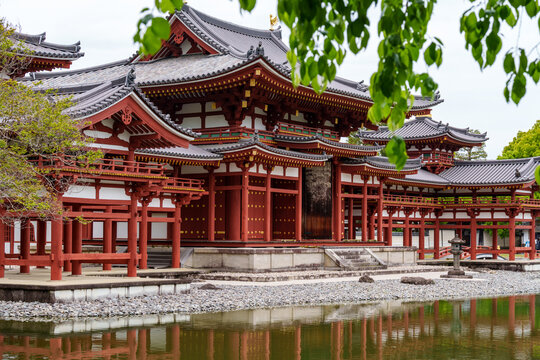 Uji, Japan - Phoenix Hall at UNESCO World Heritage Site of Byodoin Temple, calm water