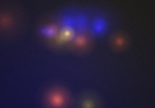 Dark blue background, with scattered glowing, circular light spots, in shades of, blue, red, and, yellow creating a, soft hazy bokeh effect