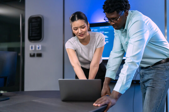 Diverse female developers and programmers engage in collaborative research discussion, demonstrating women in technology leadership and innovation exploration.