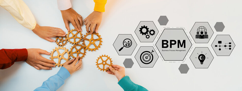 A group of diverse hands interact with wooden gears symbolizing teamwork and strategy in business process management, ideal for corporate projects and concepts. Trope