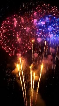 Vibrant Green And Gold Fireworks Exploding in Night Sky During Festive Celebration And Holiday Display