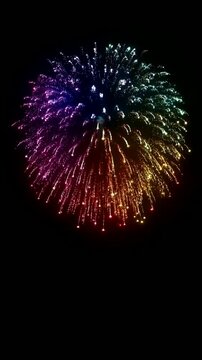 Vibrant Colorful Firework Explosion Lighting Up Dark Night Sky With Celebration Glow