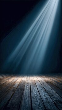 Light dances on a wooden stage in a darkened room