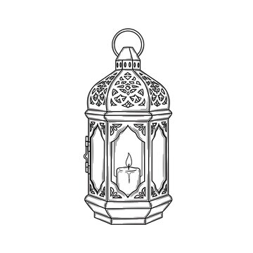Lantern with lit candle inside intricate design