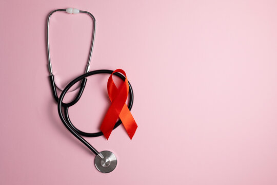 Red awareness ribbon symbolizing the fight against HIV and AIDS, solidarity with people living with HIV and remembrance