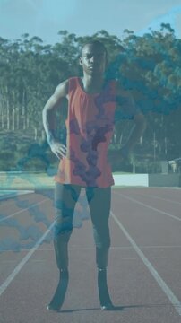 DNA strand and data processing animation over athlete standing on running track