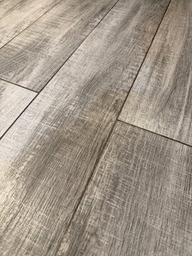 Wooden floorboards arranged in diagonal pattern, ideal as background or for interior design concepts