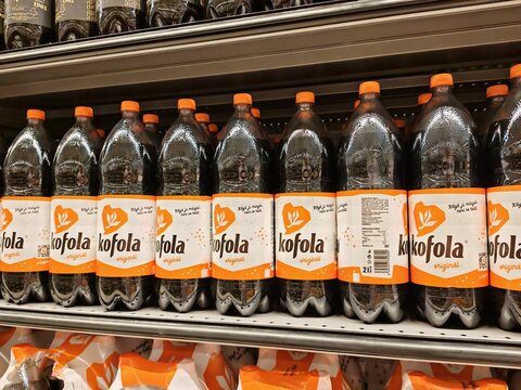 Prague,Czech Republic-8 July 2025:Kofola soft drink bottles arranged on supermarket shelf