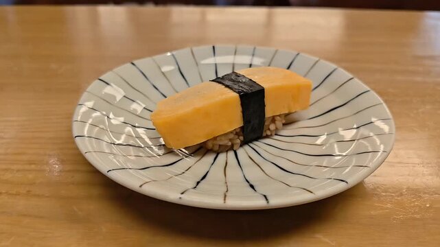 Tamagoyaki sweet savory egg omelet sushi with nori seaweed, Japanese Cuisine, Healthy Protein Food, Culinary breakfast, Appetizer Lunch Side Dish, Asian Cuisine, Rotating Slow Motion