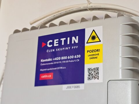 Prague,Czech Republic-31 July 2026:CETIN fiber-optic network distribution box and warning label, alternate view