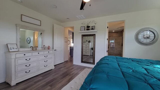 Bright turquoise bed in a modern sunny bedroom