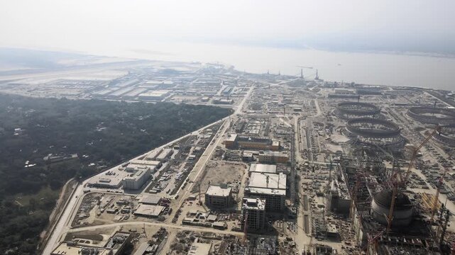 Nuclear Power Plant Construction Site with Reactor Buildings and Cooling Towers Aerial View