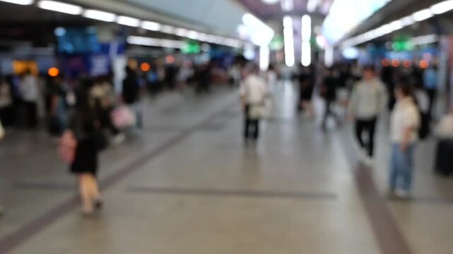 Slow motion Asian crowd at city train station 