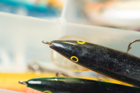 Black fishing lure with yellow eye The Concept of outdoor recreation