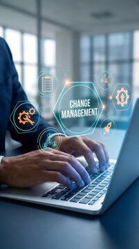 Close-up of businessman typing on a laptop with change management floating interface graphic