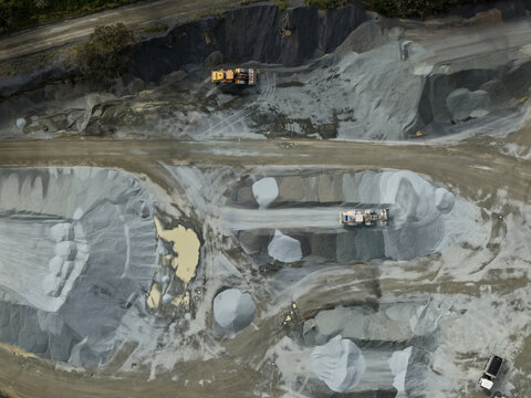 Montrose, Australia - 26 August 2026: Aerial view of Boral Montrose quarry featuring heavy machinery, piles of crushed stone, and industrial excavation patterns.