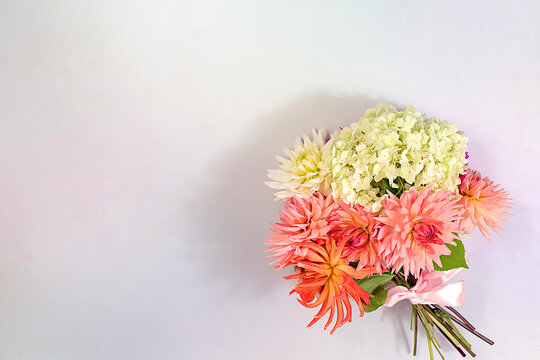 Sunny greeting card with a beautiful bouquet of dahlias, abstract floral arrangement and autumn still life with seasonal flowers, background and banner for the screen, minimalist holiday concept,