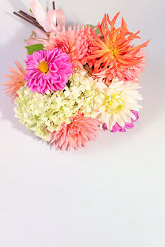 Sunny greeting card with a beautiful bouquet of dahlias, abstract floral arrangement and autumn still life with seasonal flowers, background and banner for the screen, minimalist holiday concept,