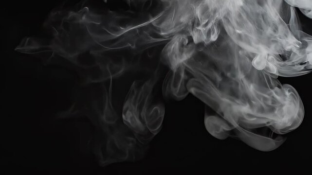 Wispy smoke plume dissipating in darkness with dramatic lighting and slow motion